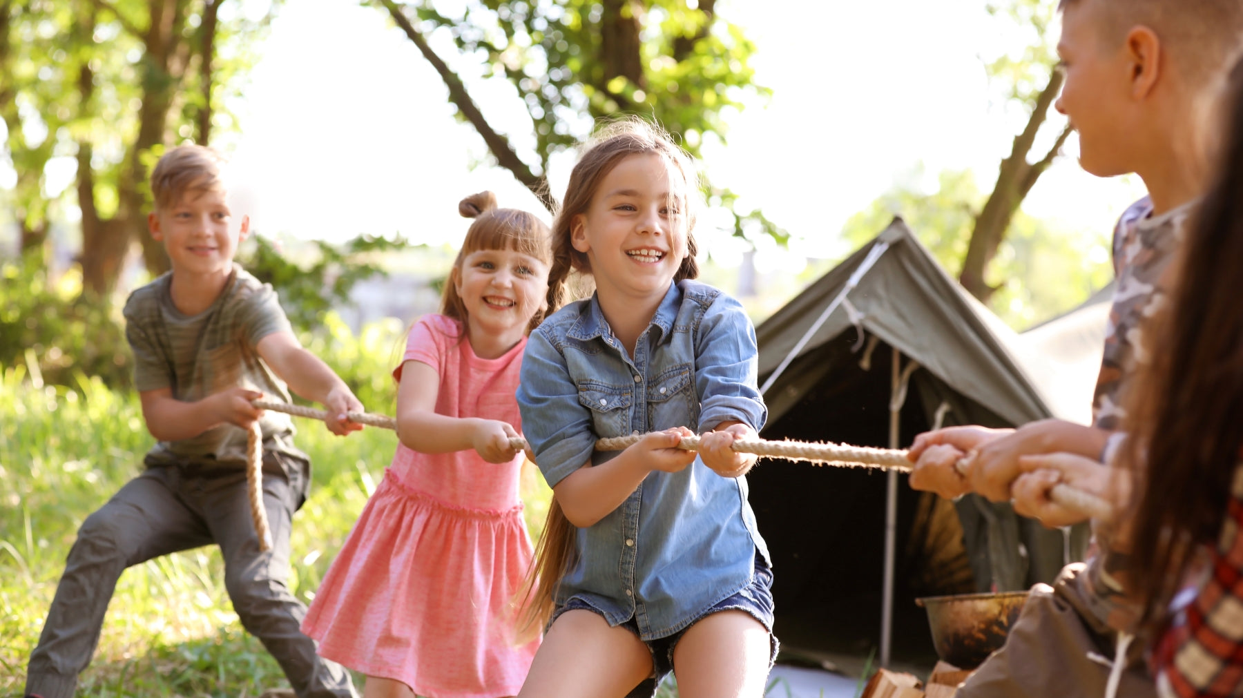 kids playing camping games with their family