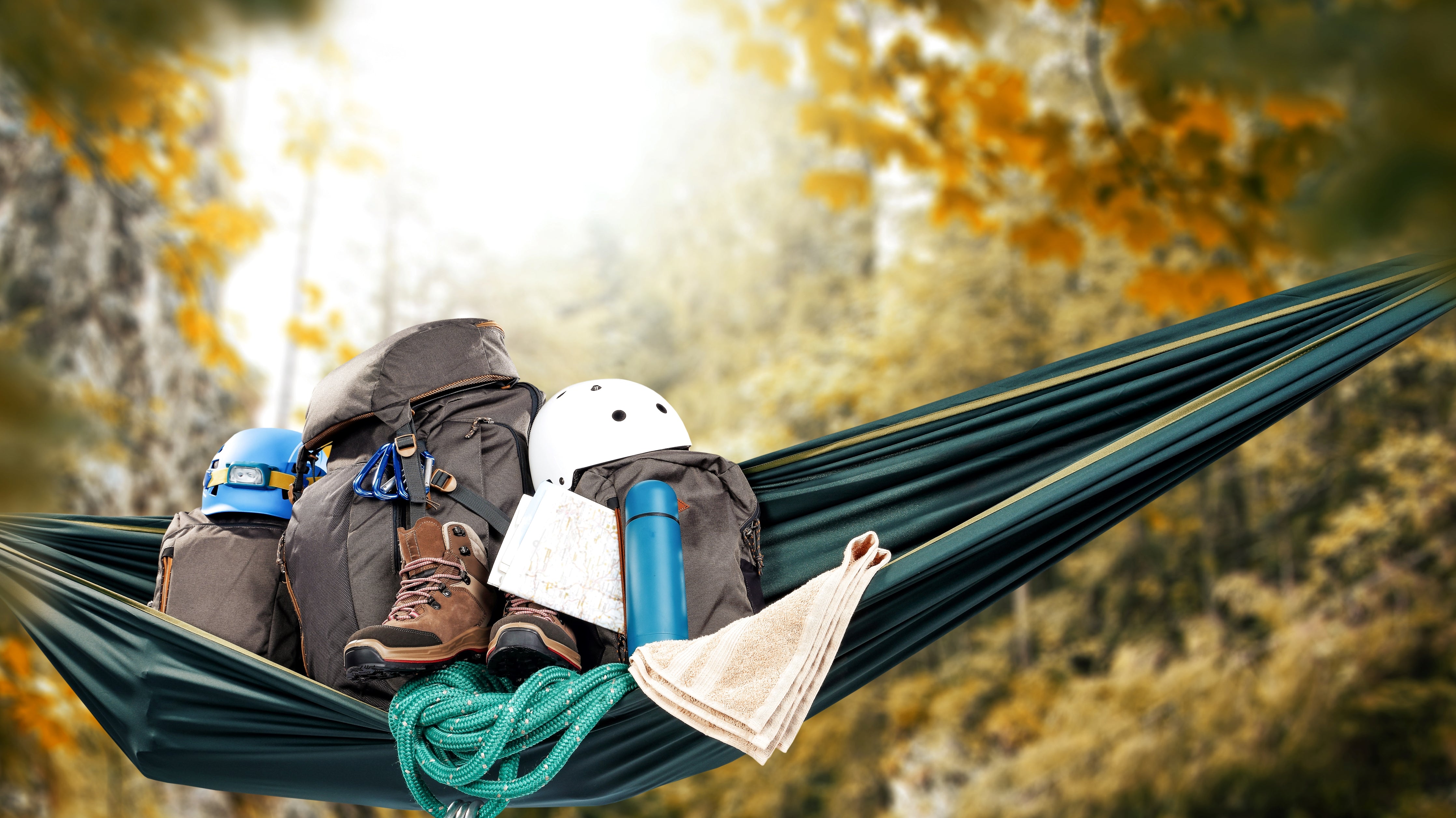 camping-gear-on-a-camping-hammock-in-the-forest-in-fall