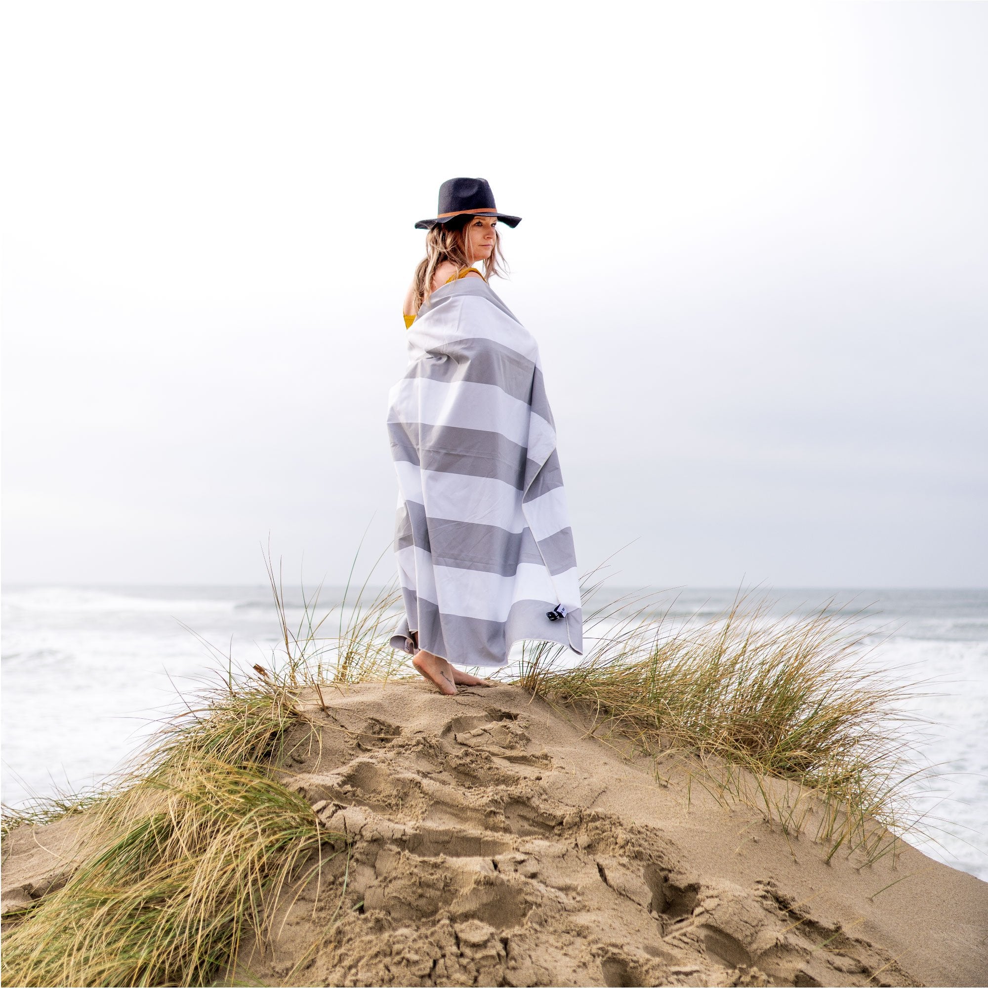 Woman with Grey Striped Beach Towel