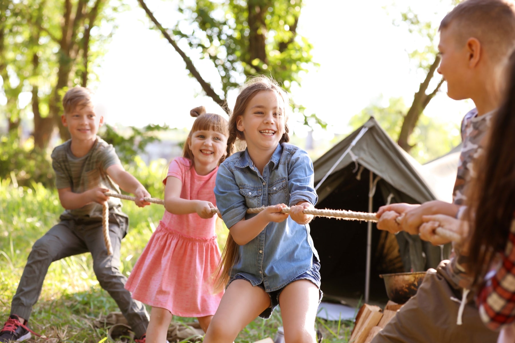 kids playing camping games with their family