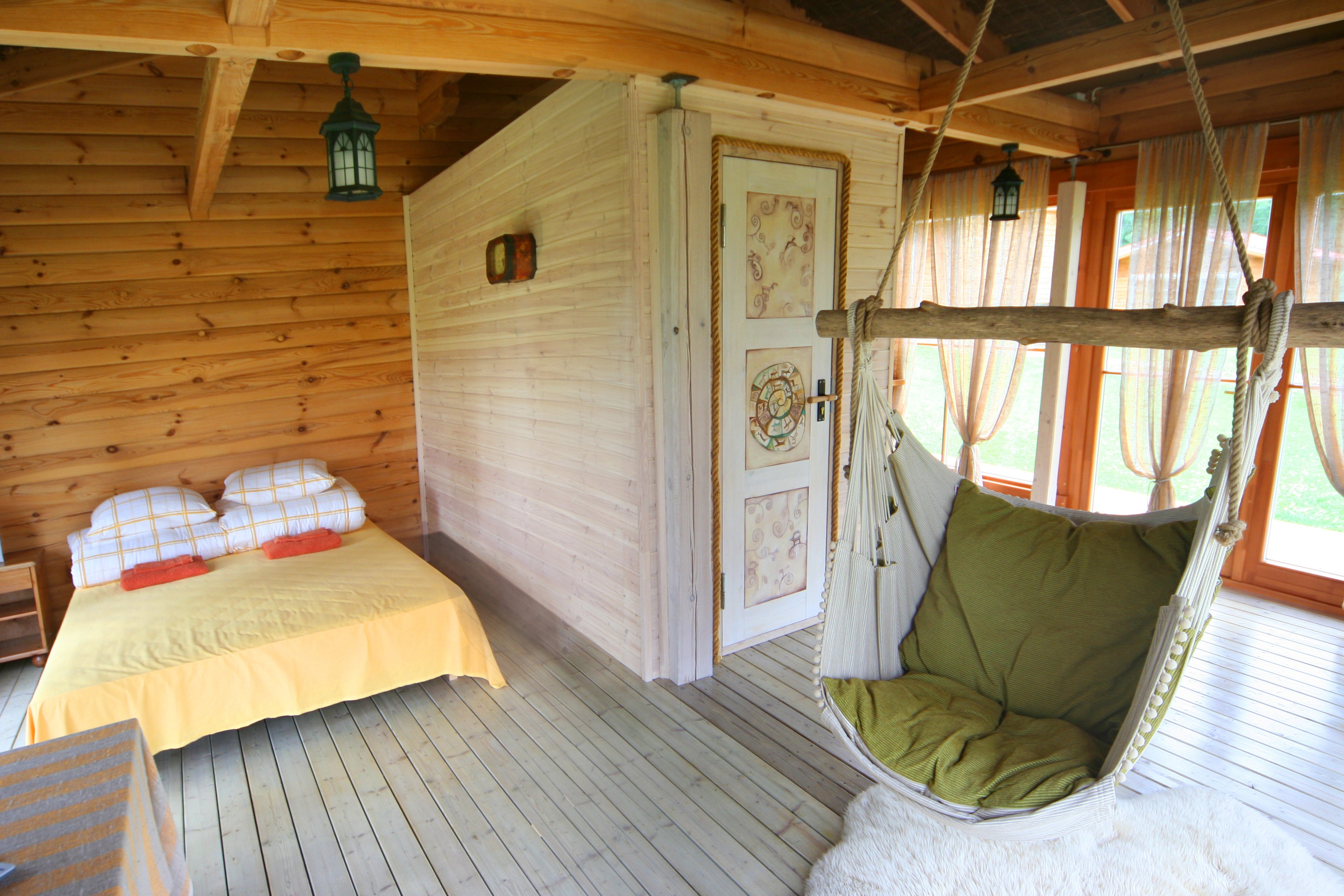 indoor hammock chair in cute summer cottage bedroom