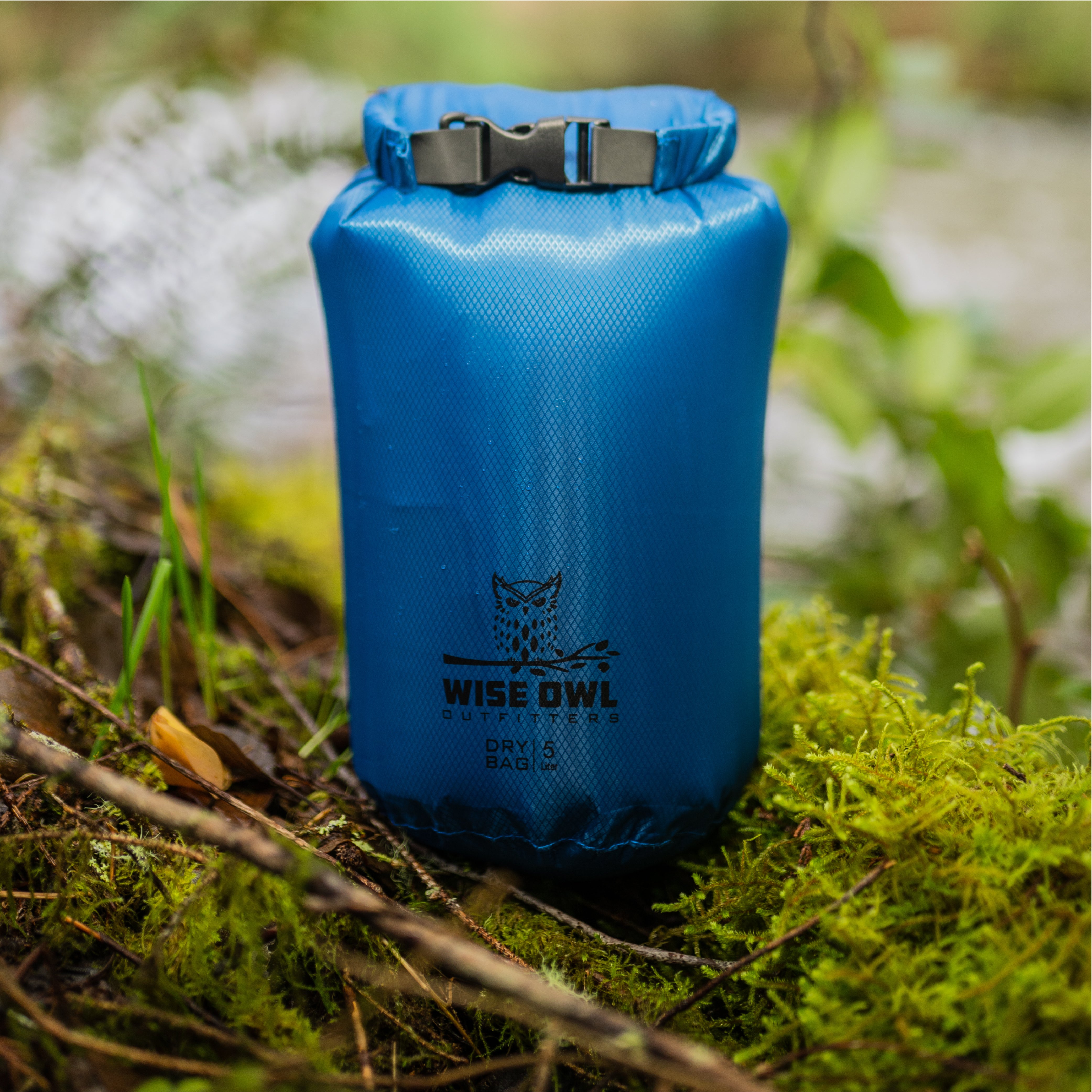 Blue Dry Bag against grass