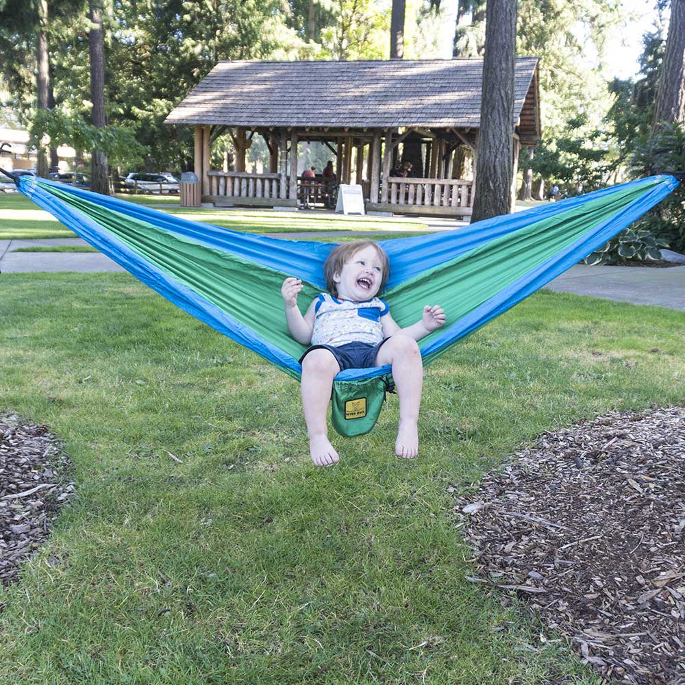 Kid in a Kelly Green & Cobalt Blue hammock