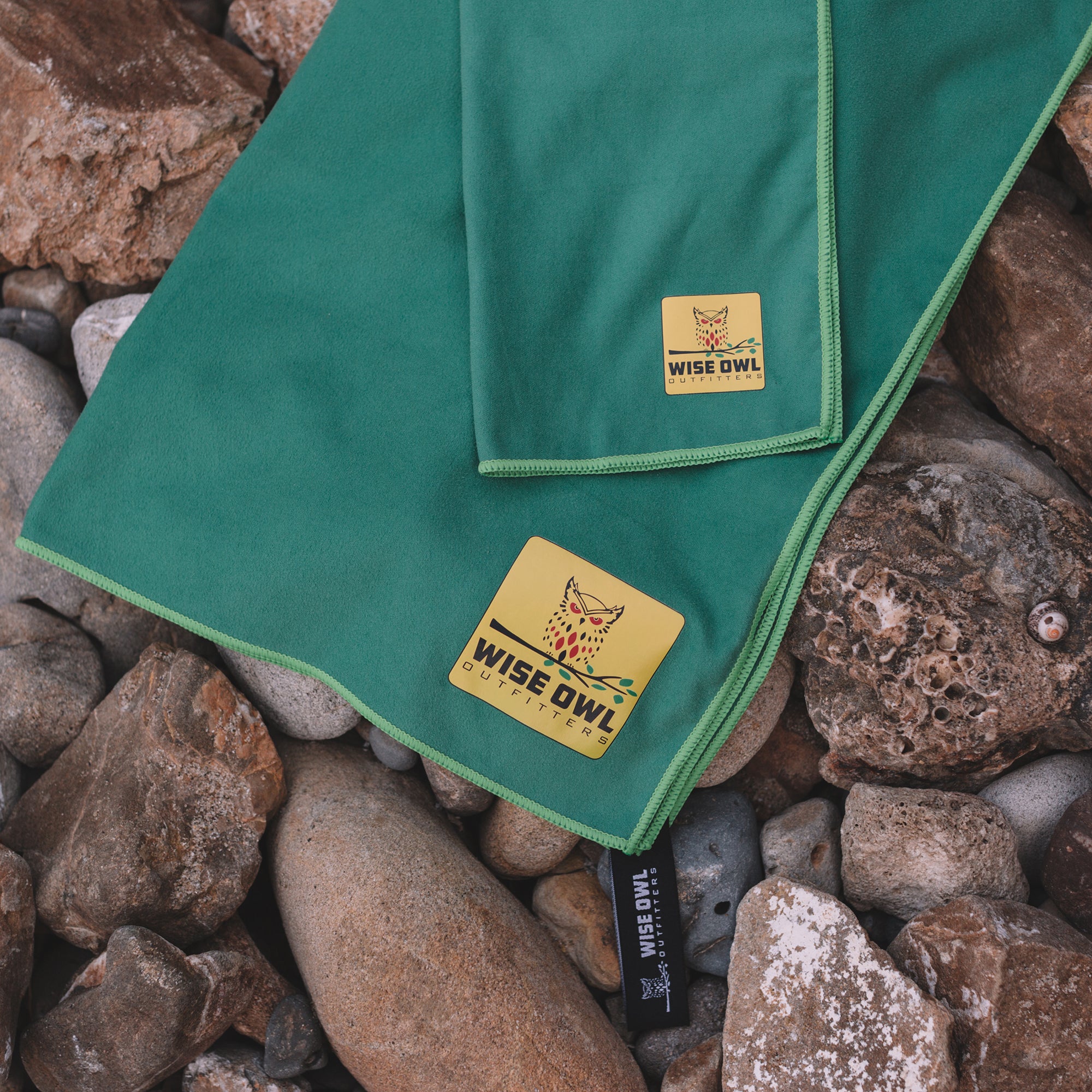 Green Camping Towel on Rocks