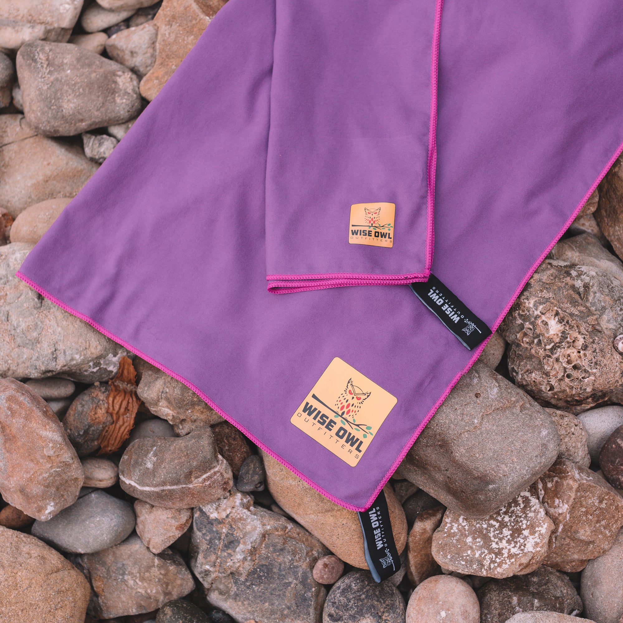 Purple Camping Towel on rocks