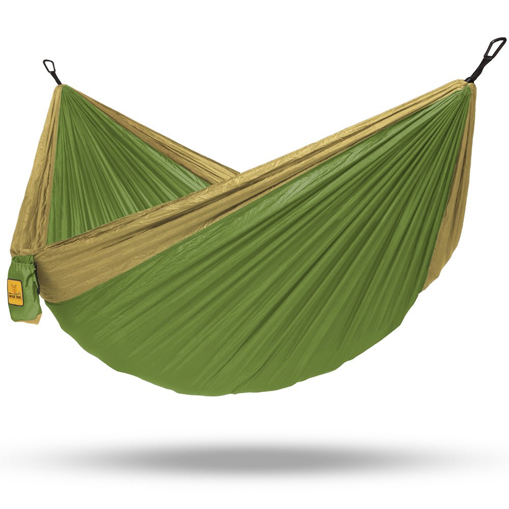 Go backpacking outdoors with a green two person hammock so you can relax anywhere. 