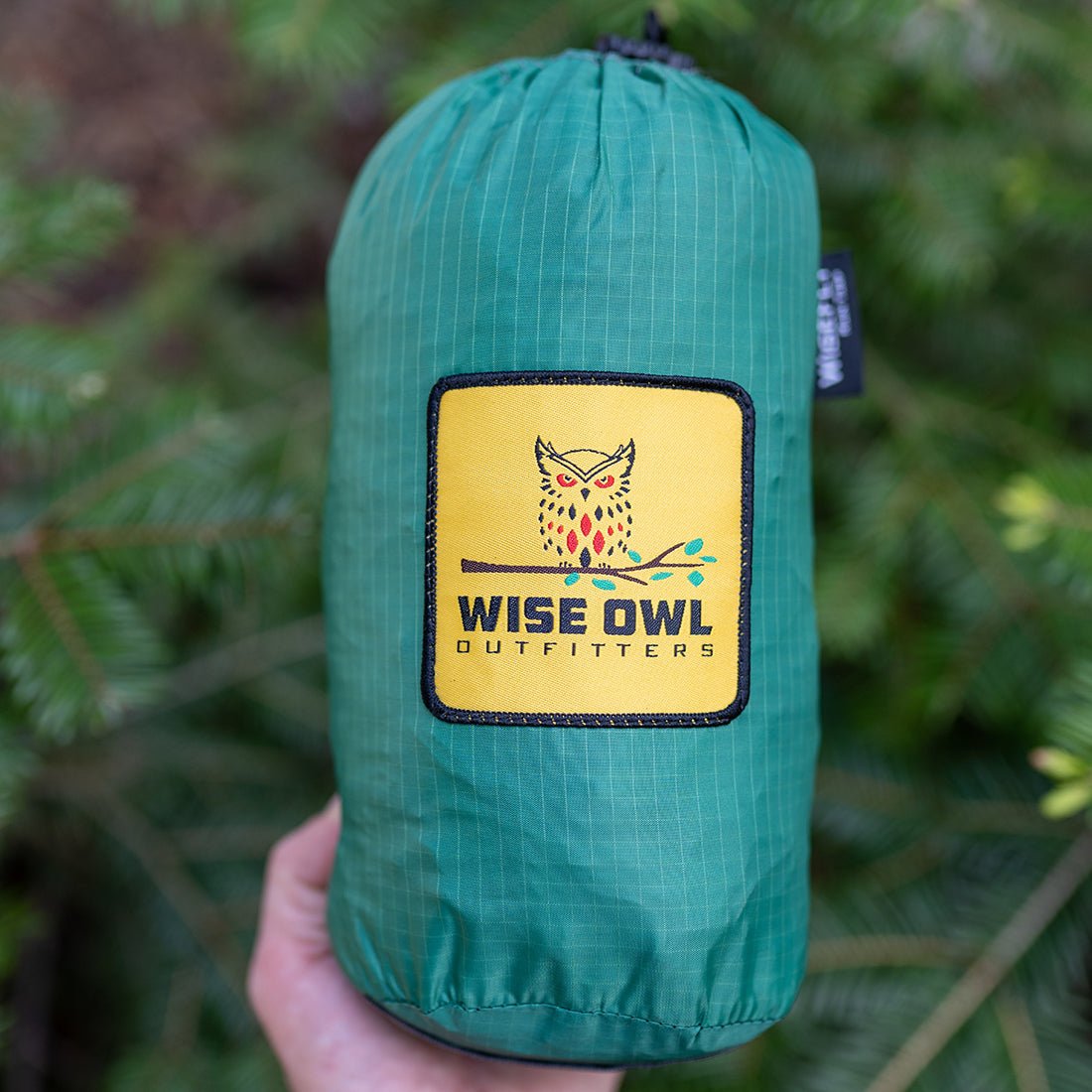 Green hammock bag holding a two person hammock for easy storage.
