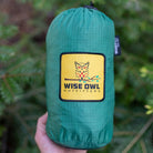 Green hammock bag holding a two person hammock for easy storage.