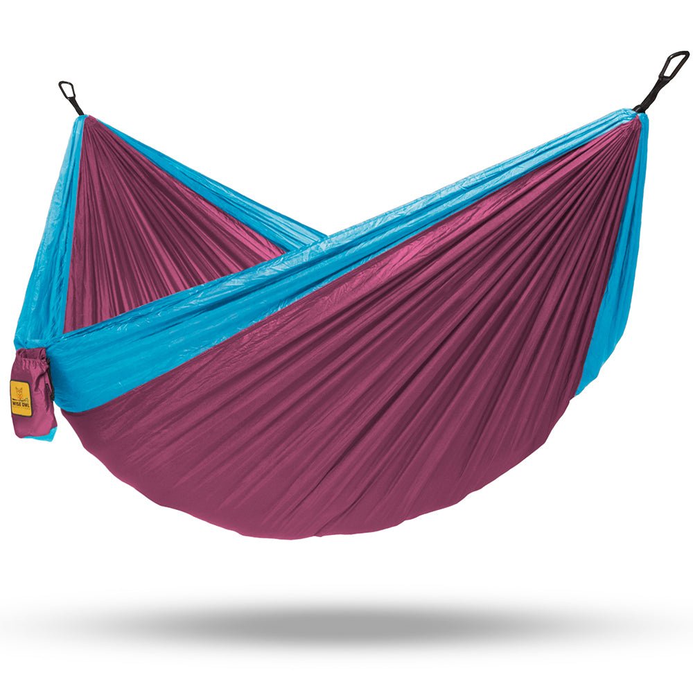 Our pink and light blue two person hammock is perfect to bring with you when camping.